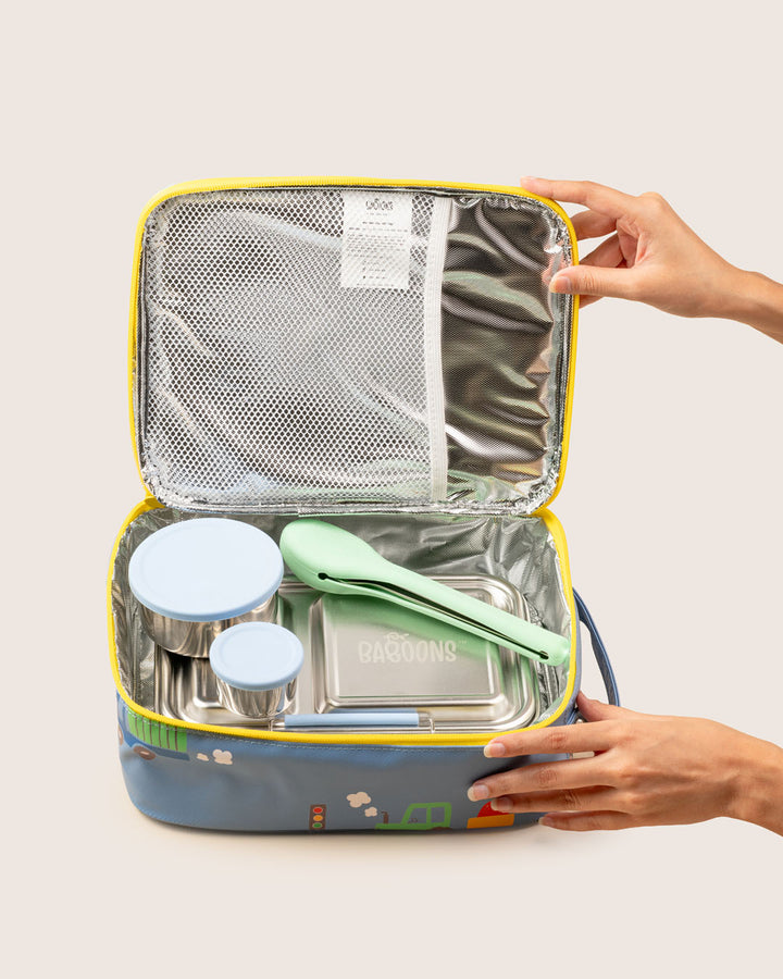 Reusable stainless steel cutlery set in mint silicone case packed inside eco-friendly lunch bag by Baboons India.