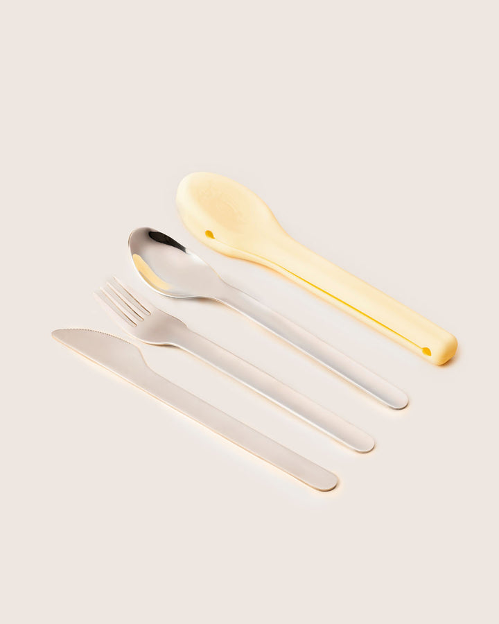 Set of cutlery including a knife, fork, and spoon in lemon yellow eco-friendly silicone case India.
