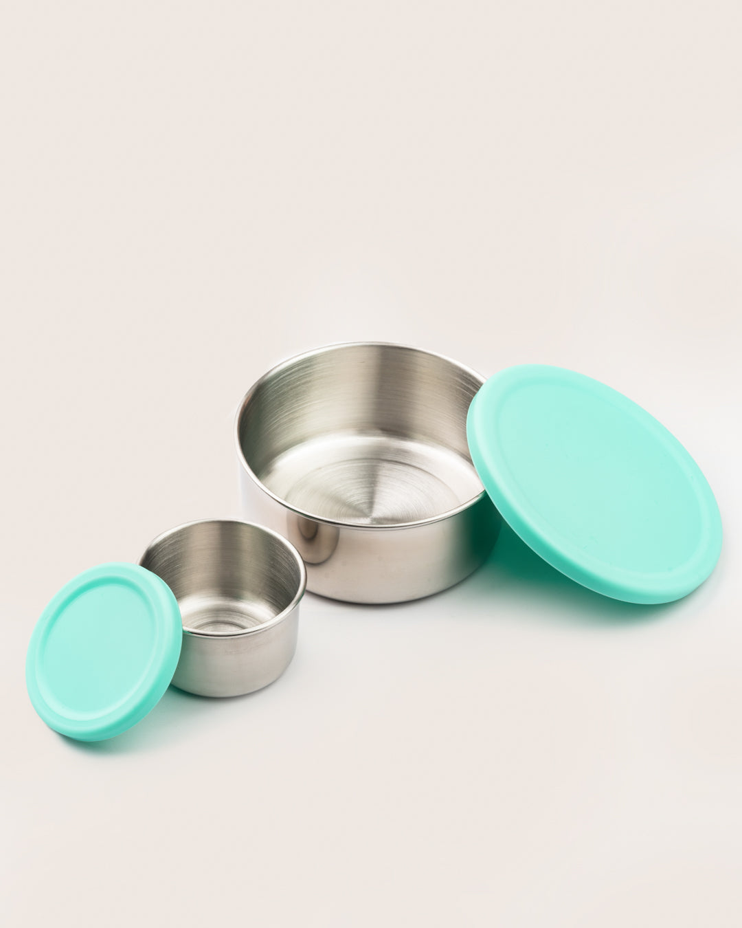 Leakproof stainless steel snack containers with aqua silicone lids, featuring large and small sizes, ideal for bento lunch boxes in India