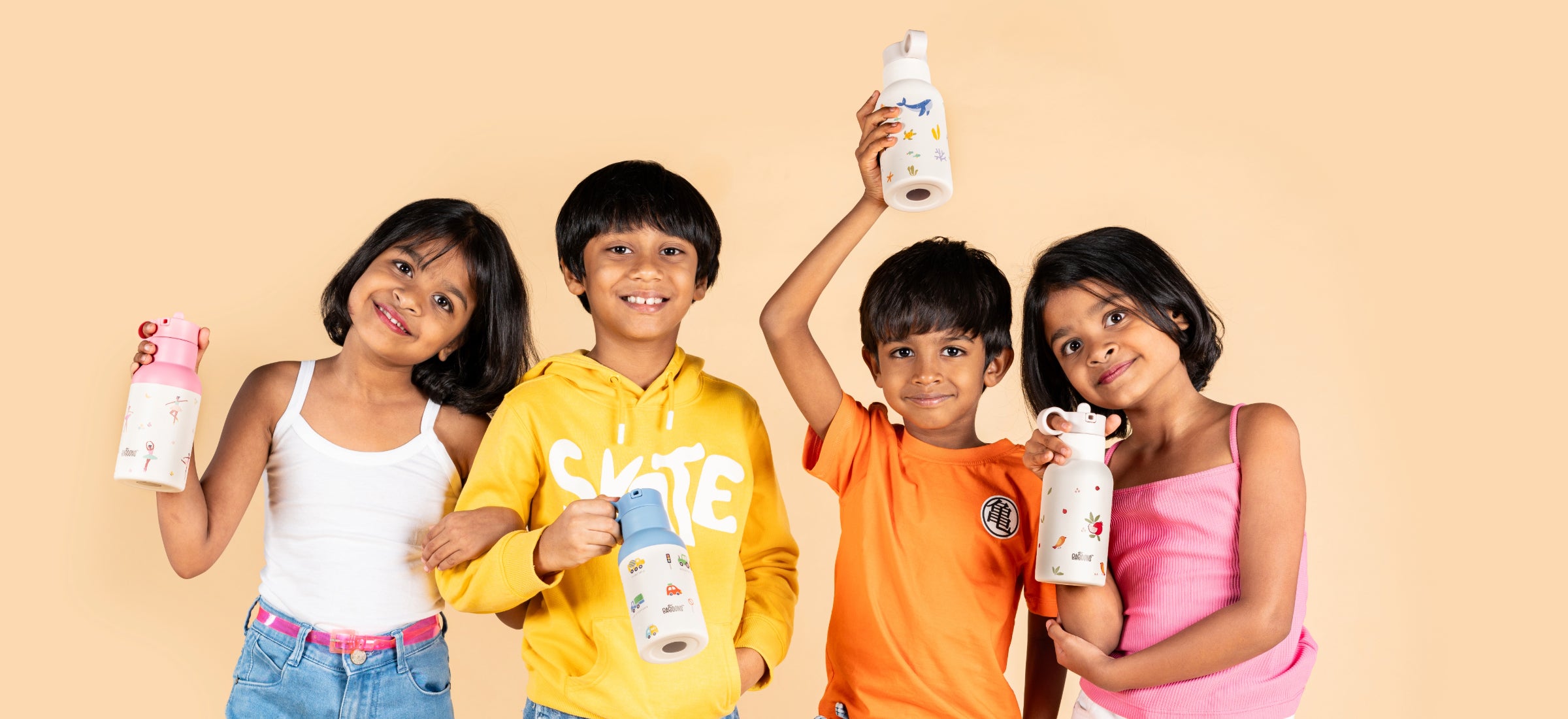 Group of happy children holding Baboons stainless steel water bottles, showcasing the stylish and functional design perfect for modern parents in India