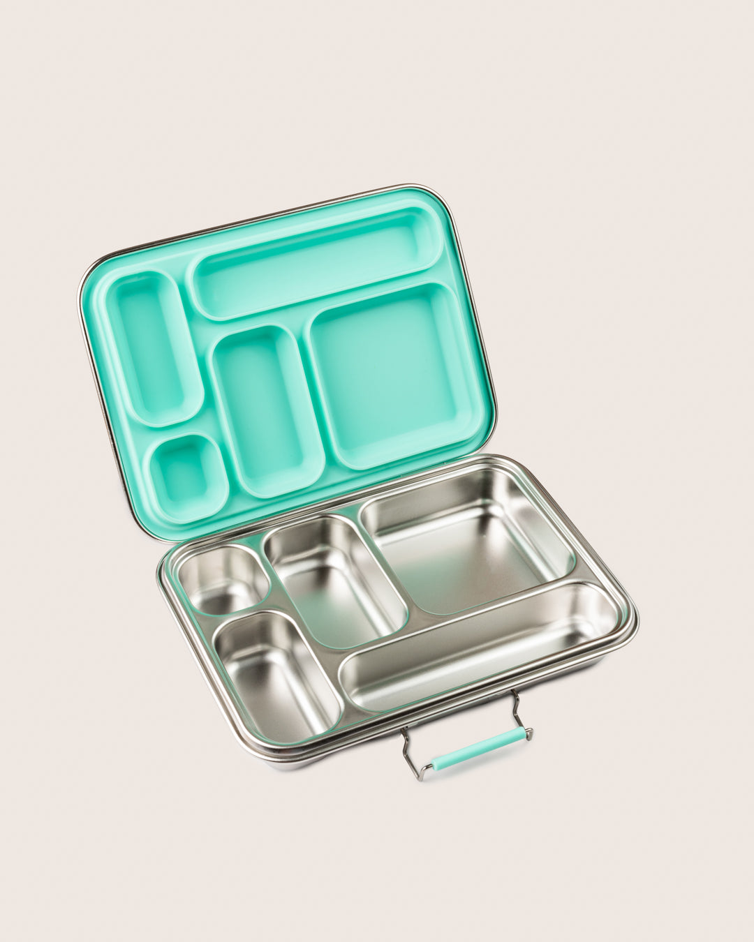 A reusable stainless-steel lunchbox in aqua with an open view showing empty compartments ready for packing lunch.