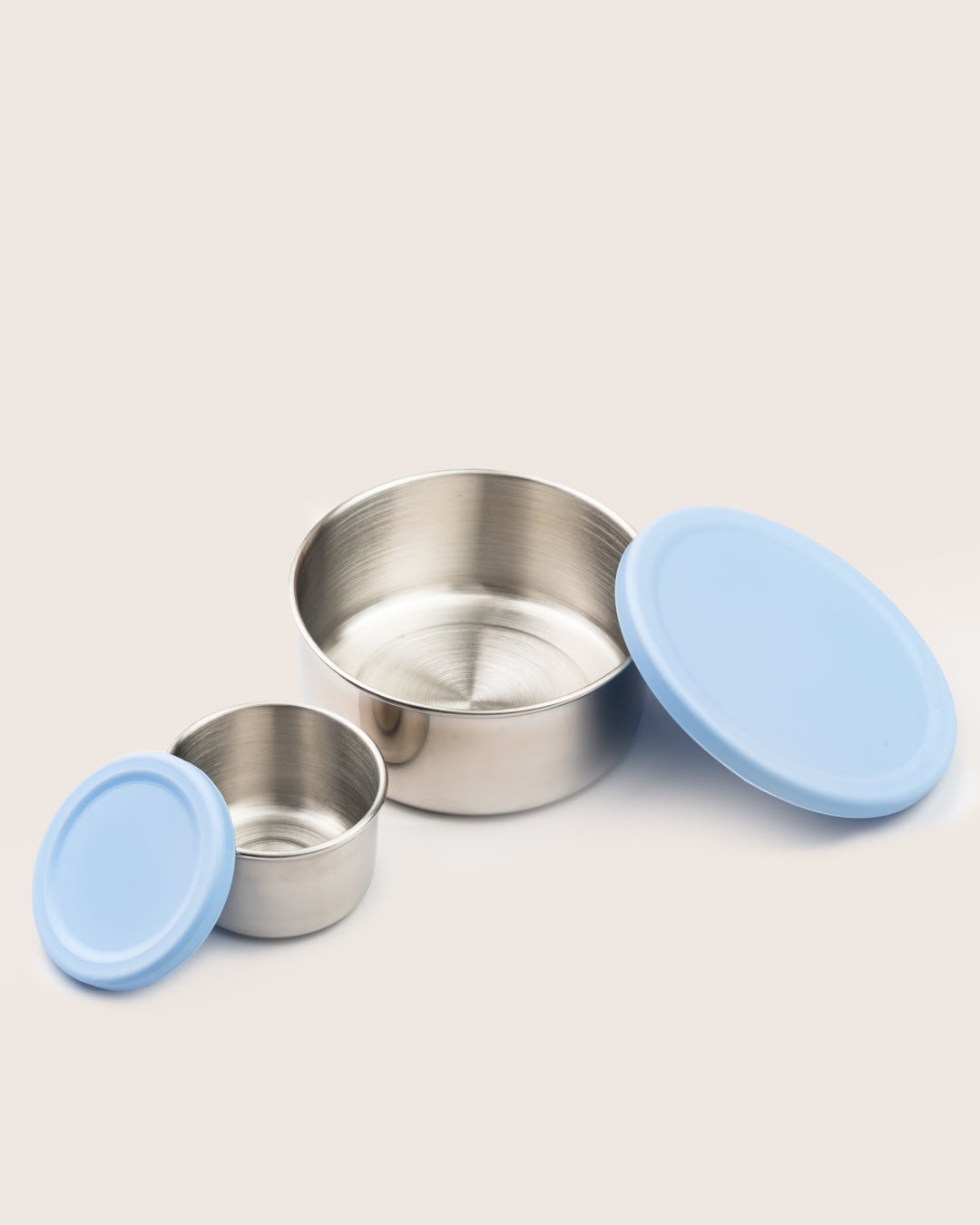 Stainless steel snack container set with blue silicone lids, featuring a large and small container, perfect for storing snacks in India