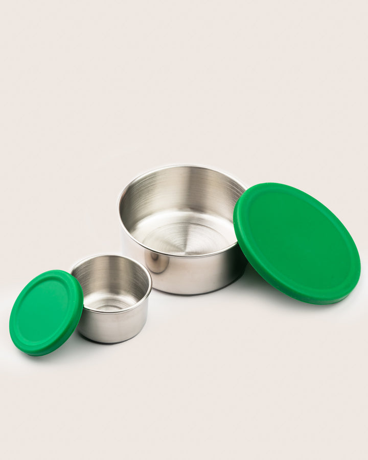 Leakproof Stainless steel snack container set with green silicone lids, including a large and a small container, ideal for snacks and dips in India