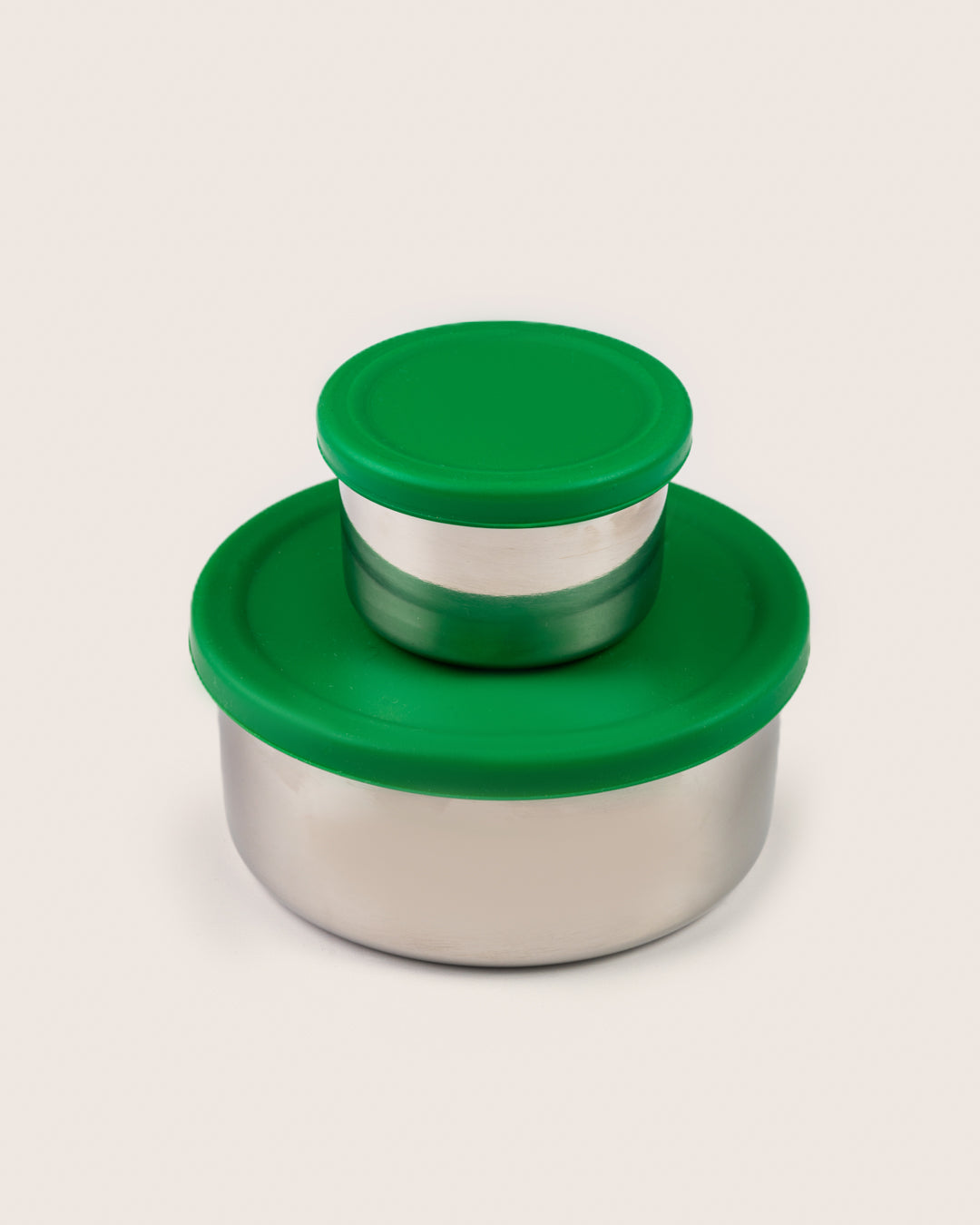 Stainless steel leakproof snack container set with green silicone lids, featuring a large container and a small dip container stacked, perfect for storing snacks and dips in India